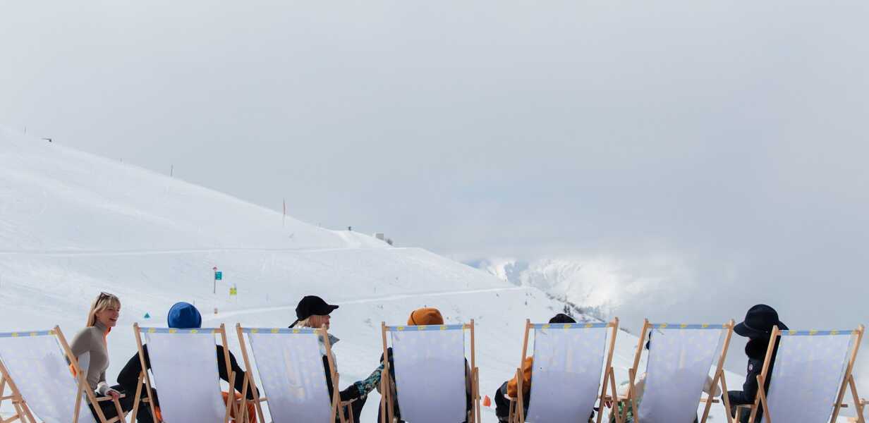 Ski break in front of a panorama of the Alps in Verbier