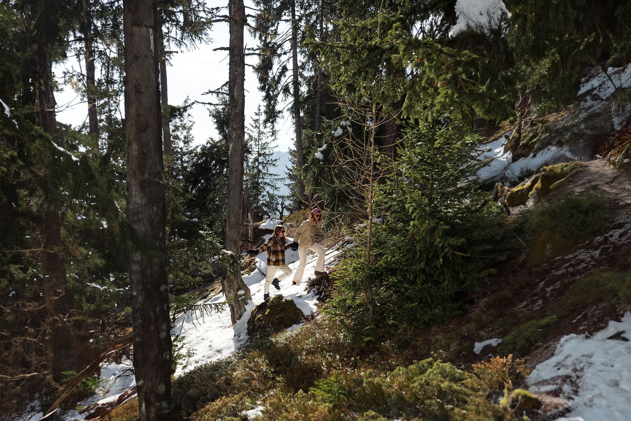 two-young-girls-walking-laughing-in-the-forest-meribel