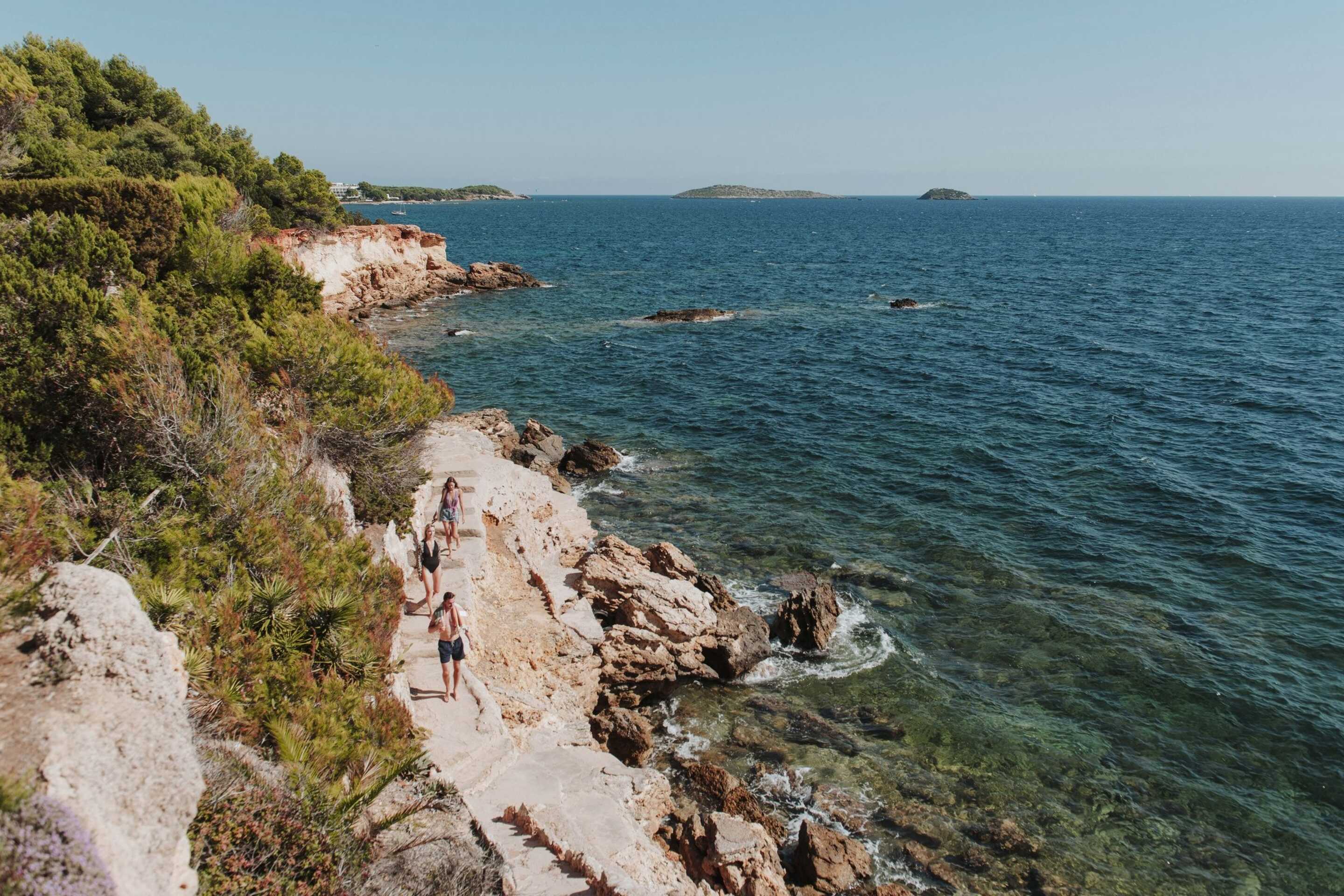 friends-walking-by-the-water-luxury-rental-balearic-islands
