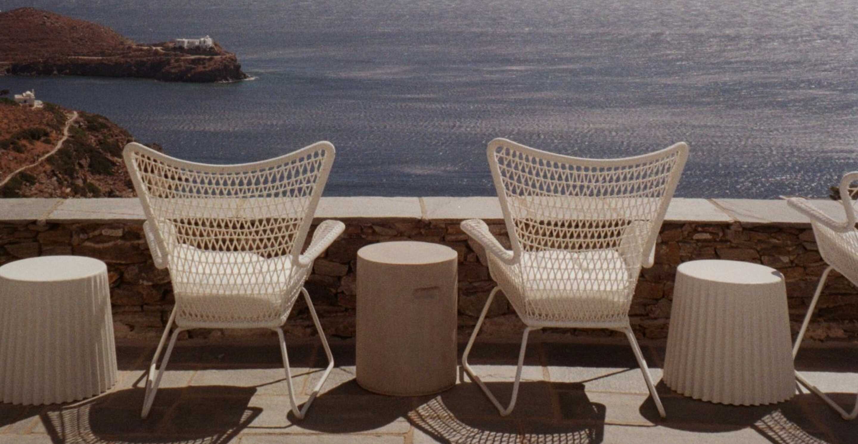 Group of friends by the beach in a luxury villa in the cyclades