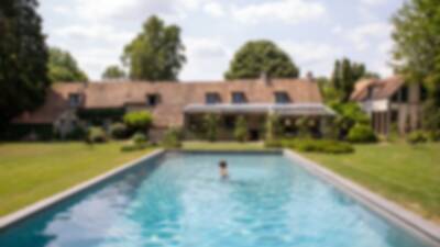 Outdoor-swimming-pool-and-villa-in-a-Normandy-luxury-property-near-to-Paris