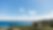 view-from-above-of-the-beach-of-a-green-island-facing-the-turquoise-sea