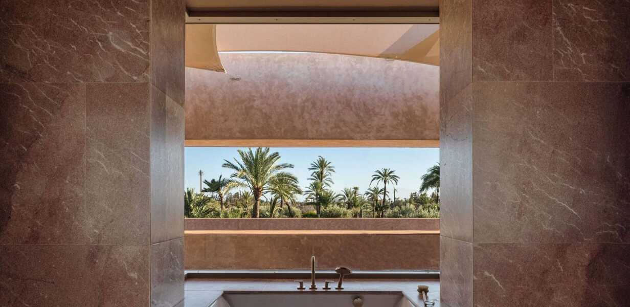 marble-bathroom-palm-trees-view