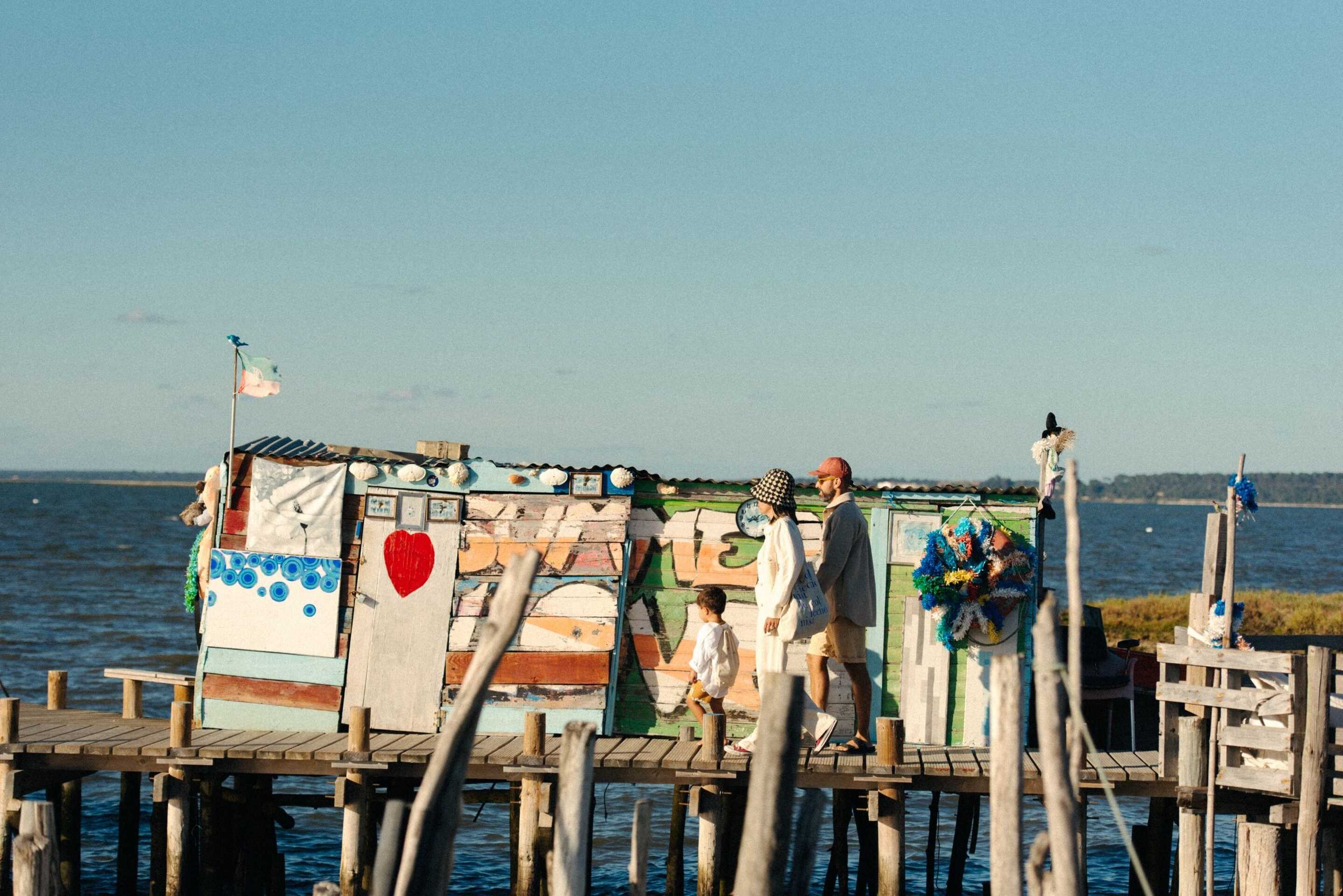 family walking by the sea 