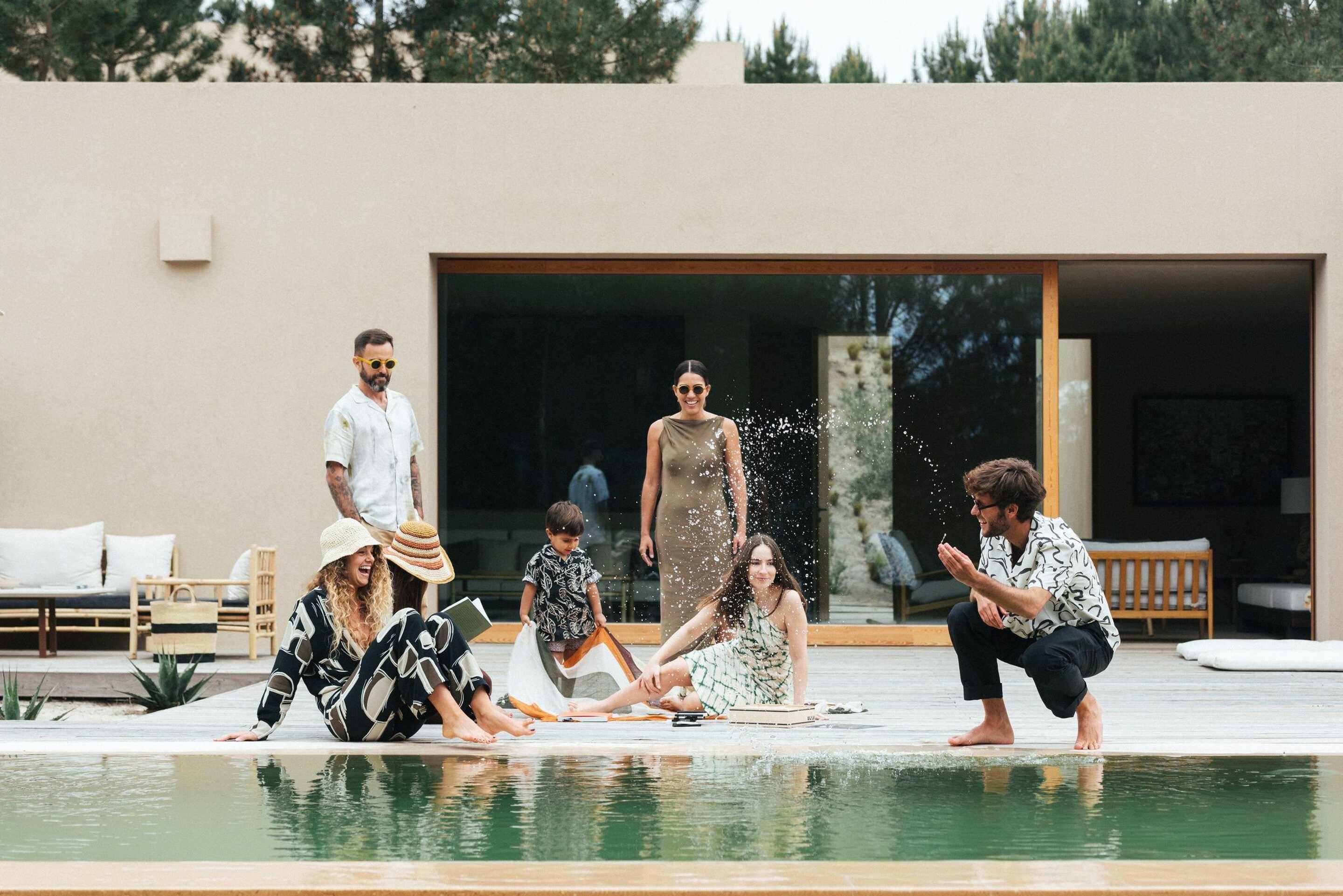 family next to pool in their luxury rental
