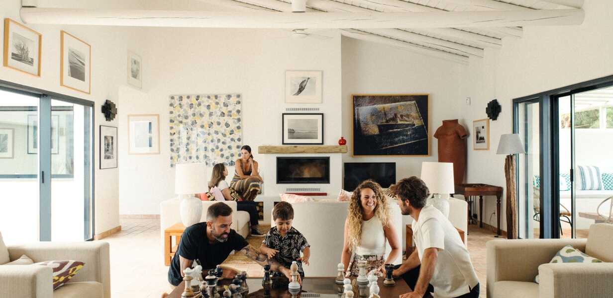 family-in-the-living-room-of-a-large-luxury-holiday-home