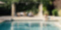 Family-relaxed-around-a-swimming-pool-of-a-luxury-villa-rental-in-Provence